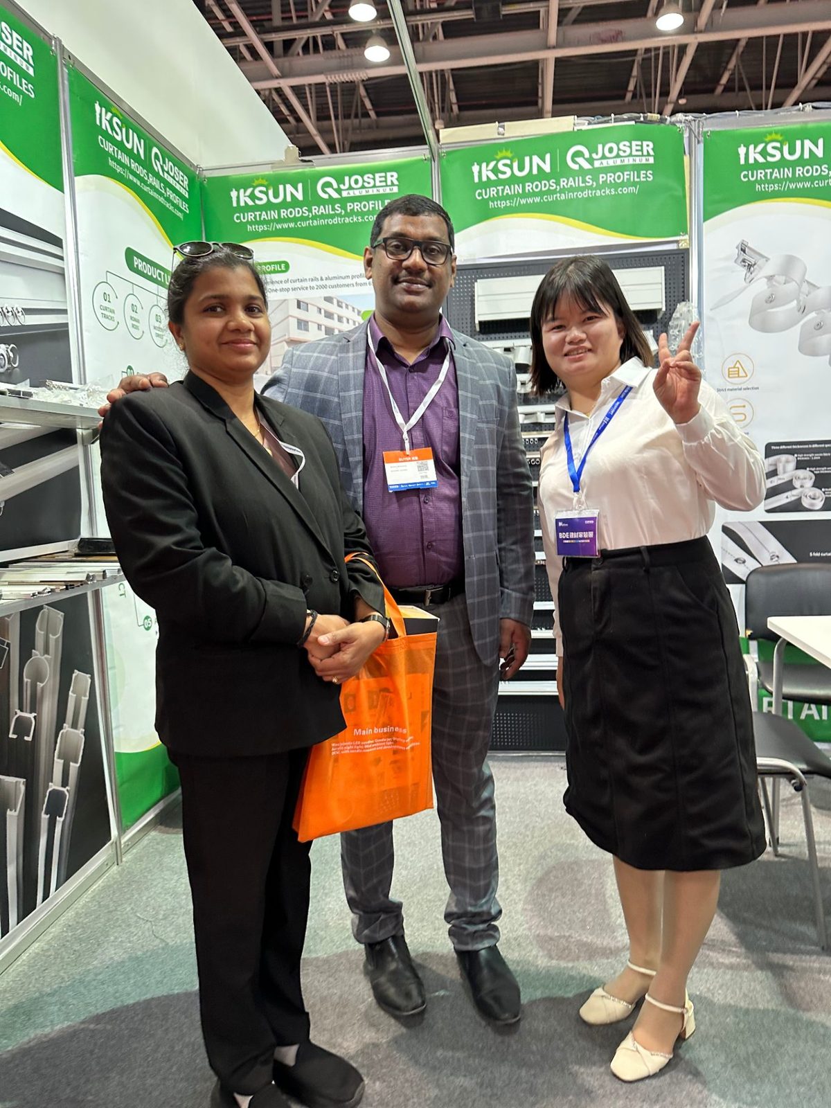 A customer from India with the IKSUN team at the Dubai trade show booth, October 2023